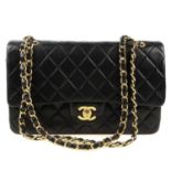 CHANEL - a Medium Classic Double Flap handbag. Designed with maker's iconic diamond quilted black