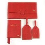 ASPINAL OF LONDON - a berry lizard leather Classic Travel Collection. Crafted from red lizard