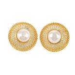 CHANEL - a pair of clip-on earrings. Of circular outline, set with a central imitation pearl, to the