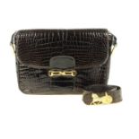 CÉLINE - a vintage crocodile handbag with matching belt. The handbag, designed with a polished brown