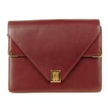 CARTIER - a Bordeaux double flap handbag. Crafted from maker's signature burgundy leather, featuring