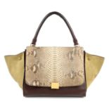 CÉLINE - a python skin trapeze handbag. Crafted from natural python skin and burgundy leather with
