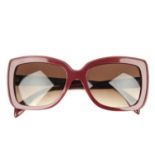 ALEXANDER MCQUEEN - a pair of sunglasses. Designed with burgundy acetate frames with matte detailing