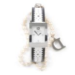 CHRISTIAN DIOR - a pearl watch. Designed as a rectangular bezel and mother-of-pearl dial, with