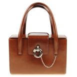 CARTIER - a Panthere Box handbag. Designed with a structured box shape in smooth brown leather