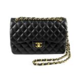 CHANEL - a Jumbo Classic Double Flap handbag. Featuring maker's iconic black quilted lambskin