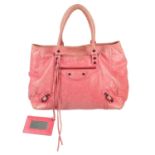 BALENCIAGA - a pink Sunday GM handbag. Crafted from glazed pink lambskin leather, featuring maker'