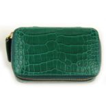 SMYTHSON - an embossed leather miniature jewellery box. Crafted from emerald green crocodile