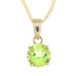 A peridot single-stone pendant. The circular-shape peridot, with tapered surmount, suspended from