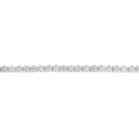 A 9ct gold diamond bracelet. Designed as a series of brilliant-cut diamonds, each within an