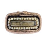 A late Georgian gold split pearl snake brooch. The glazed rectangular interwoven hair panel, with