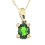 A 9ct gold tourmaline and gem-set pendant. The oval-shape green tourmaline, within a circular-