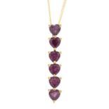 A 9ct gold garnet pendant. The heart-shape garnet line, suspended from a 9ct gold curb-link chain.