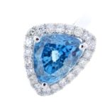 A zircon and diamond cluster ring. The triangular-shape blue zircon, with brilliant and single-cut