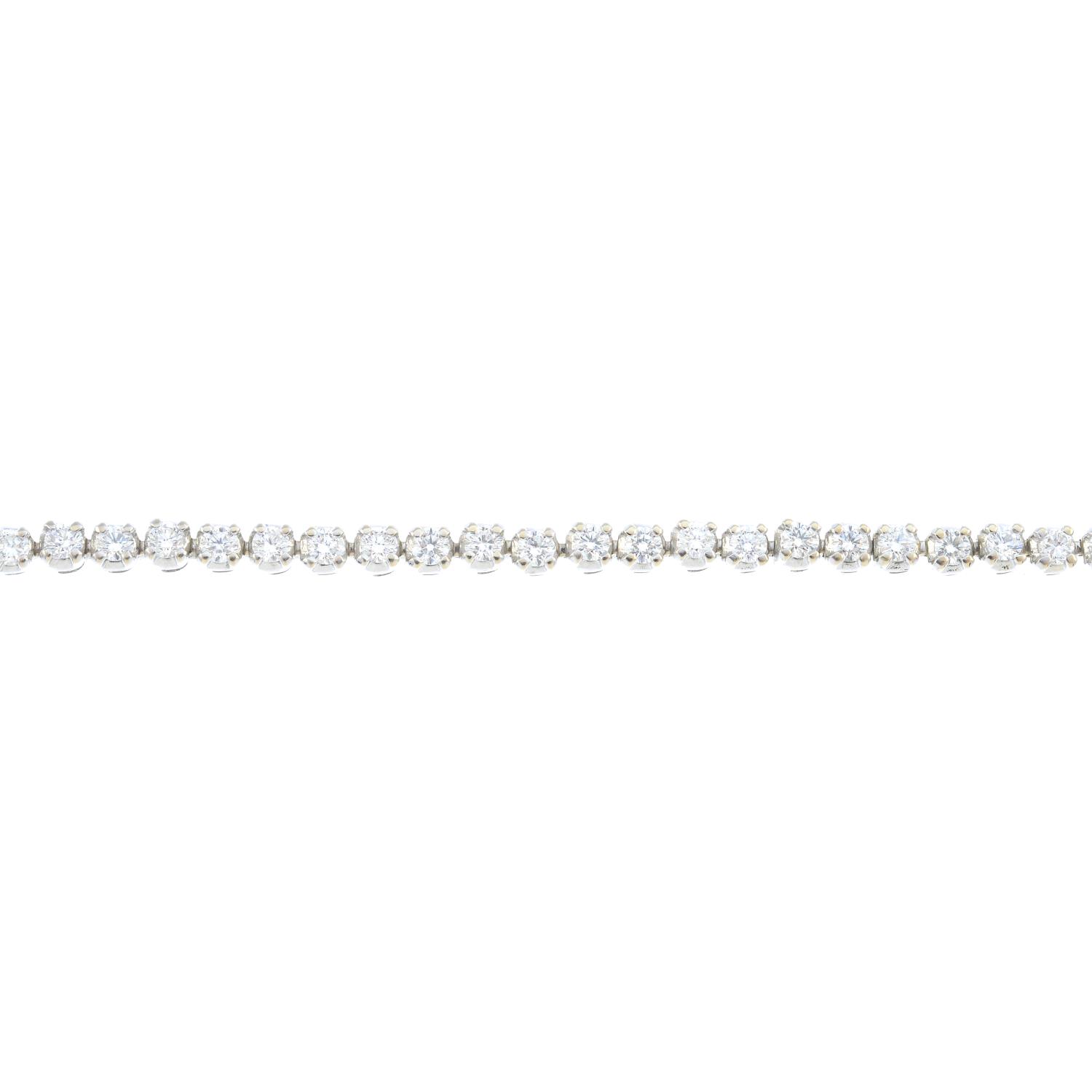 A diamond bracelet. Designed as a brilliant-cut diamond line, with partially concealed push-piece