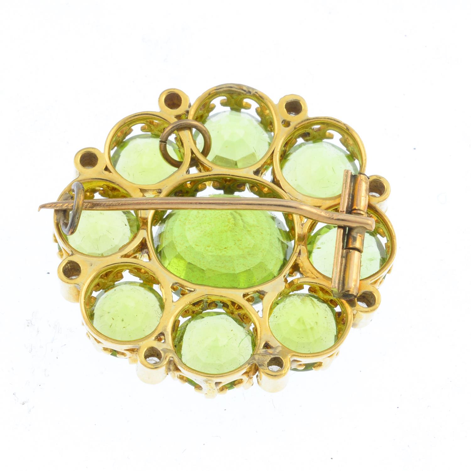 An early 20th century gold, peridot and diamond cluster brooch. The oval-shape peridot, with - Image 2 of 2