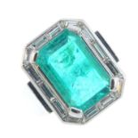A Colombian emerald and diamond ring. The rectangular-shape emerald, weighing 6.15cts, with