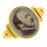 A mid Victorian gold portrait ring. Comprising an early photograph of Prince Albert, with recessed