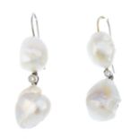 A pair of natural pearl and diamond earrings. Each designed as a baroque pearl, suspended from a