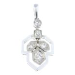 A mid 20th century diamond pendant. Designed as a stylised hawthorn leaf, the old-cut diamond