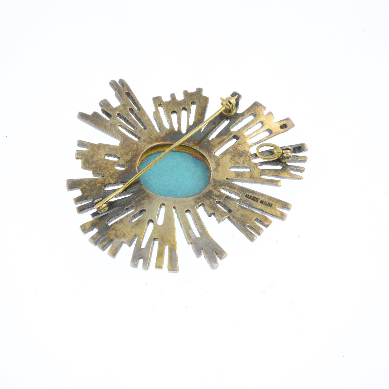 A mid 20th century turquoise brooch. Of openwork design, the oval turquoise cabochon, with textured, - Image 2 of 2