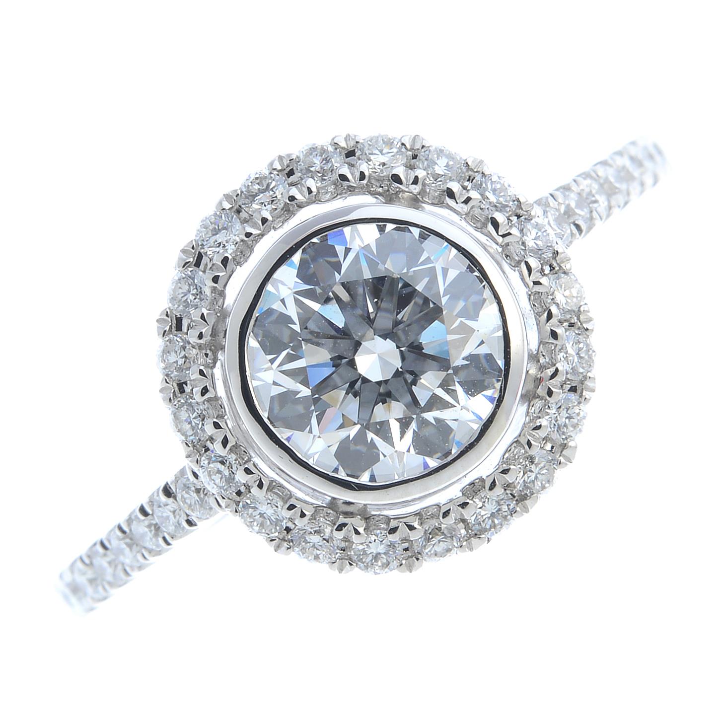 A diamond single-stone ring. The brilliant-cut diamond collet, weighing 1.14cts, with similarly-