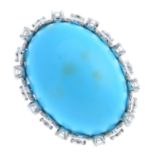 A reconstituted turquoise diamond dress ring. The oval reconstituted turquoise cabochon, to the