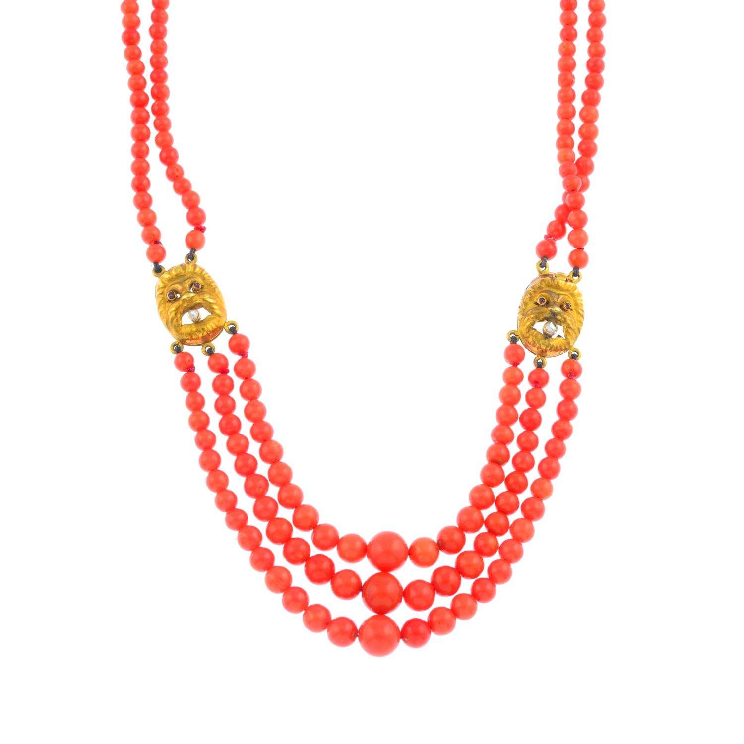 A coral, ruby and diamond necklace. The three graduated coral bead strands, to rose-cut diamond