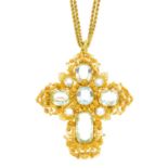 An early Victorian gold aquamarine pendant. The oval-shape aquamarine cross, with circular-shape