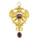 A late Victorian Gothic Revival gold garnet and diamond pendant. Of openwork design, the cushion-