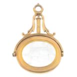 A Georgian gold chalcedony swivel fob. The chalcedony engraved to depict an armorial shield, the