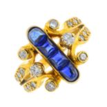 A sapphire and diamond dress ring. Designed as a calibre-cut sapphire cabochon line, with
