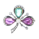 A late Victorian Burmese ruby, Colombian emerald and gem-set brooch. Designed as a shamrock, the