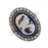 A mid Victorian gold agate cameo diamond cluster ring. The onyx cameo carved to depict a man with