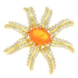 A fire opal and diamond floral brooch. The oval-shape fire opal, with brilliant-cut diamond two-