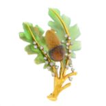 A mid 20th century diamond and hardstone acorn brooch. The hardstone acorn and oak leaves, to