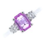 An 18ct gold sapphire and diamond three-stone ring. The rectangular-shape pink sapphire, with