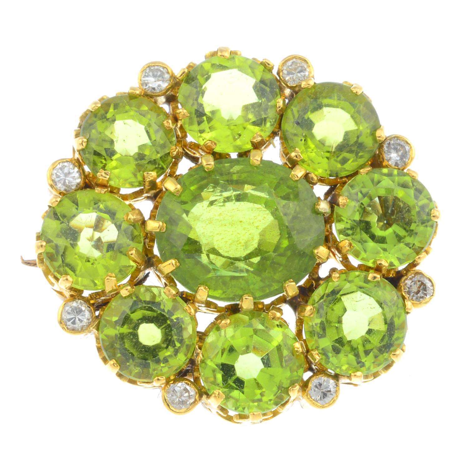 An early 20th century gold, peridot and diamond cluster brooch. The oval-shape peridot, with