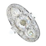 A diamond ring. Of oval outline, the old-cut diamond and pear-shape diamond sides, with old-cut