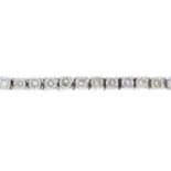 A diamond bracelet. Designed as a brilliant-cut diamond line, with partially concealed push-piece