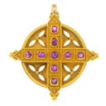 A mid Victorian Gothic Revival gold ruby pendant. The cushion-shape ruby cannetille cross, set