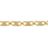 A diamond bracelet. Designed as a series of pave-set diamond rectangular-shape links with openwork