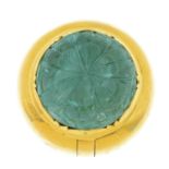 An emerald pill box. The circular emerald cabochon, carved with a foliate motif, to the hinged