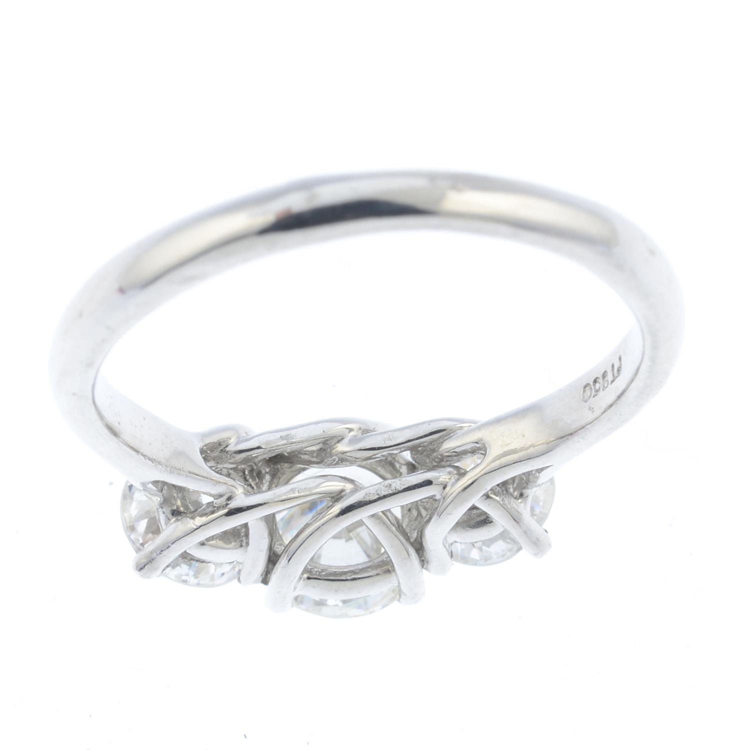 A diamond three-stone ring. Designed as a graduated brilliant-cut diamond line, with crossover - Image 2 of 3