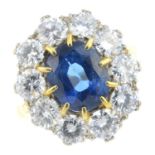 A sapphire and diamond cluster ring. Designed as an oval-shape sapphire, with brilliant-cut