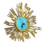 A mid 20th century turquoise brooch. Of openwork design, the oval turquoise cabochon, with textured,