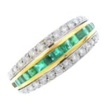 An 18ct gold emerald and diamond dress ring. Of bi-colour design, the calibre-cut emerald line,