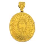 A late Victorian gold locket and chain. The scrolling foliate engraved oval-shape locket,