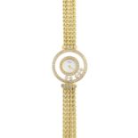 CHOPARD- a lady's 18ct gold 'Happy Diamonds' cocktail watch. The circular dial, with single-cut