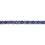 An early 20th century gold, sapphire and diamond bar brooch. Designed as a circular-shape sapphire